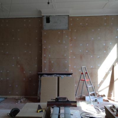 Woonkamerwand bekleed met Pavadentro